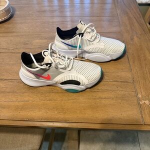 Nike SUPERREP 
White and Black Athletic Shoes with Red Accents